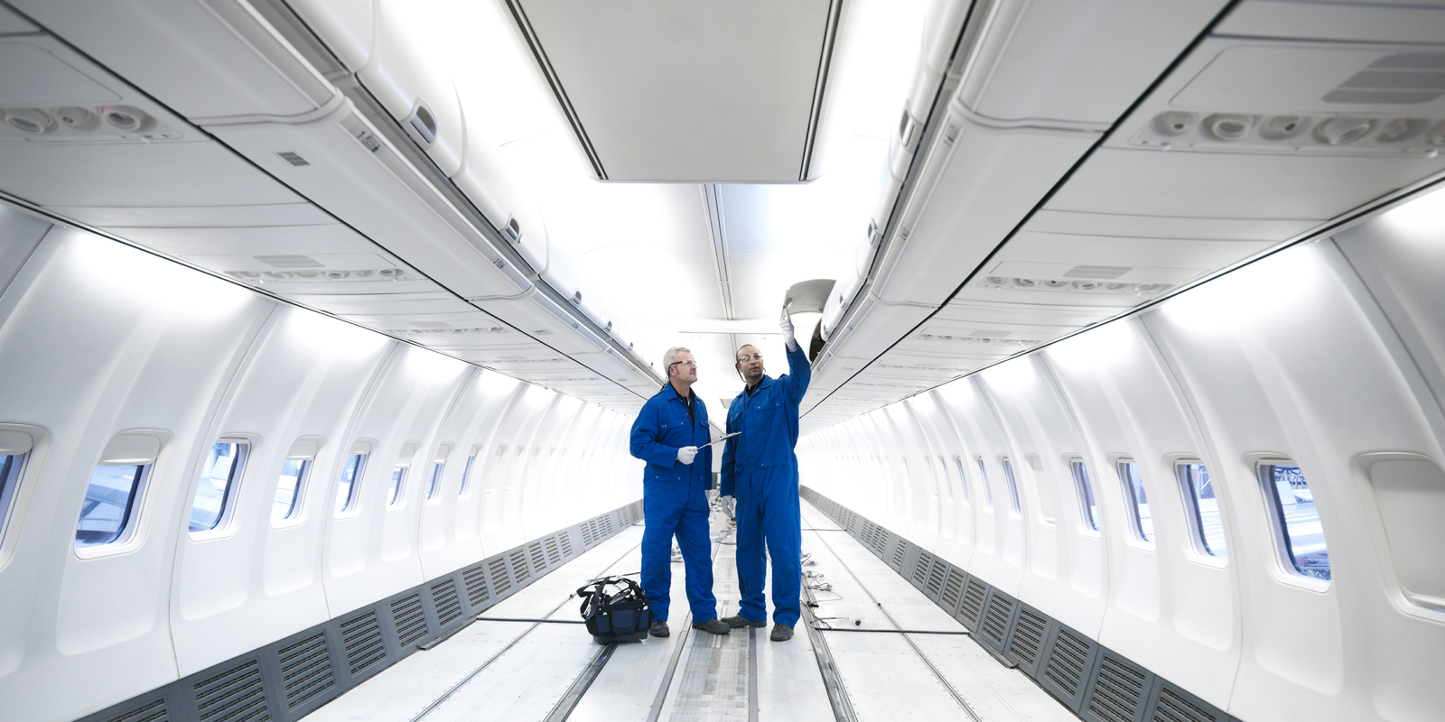 Aircraft engineers inside a jet airplane